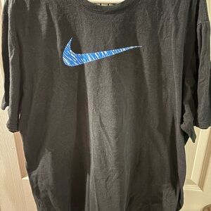 Nike Men's Black Tee with Blue Swoosh